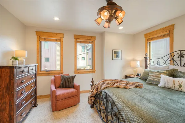 a bedroom with a bed and a couch