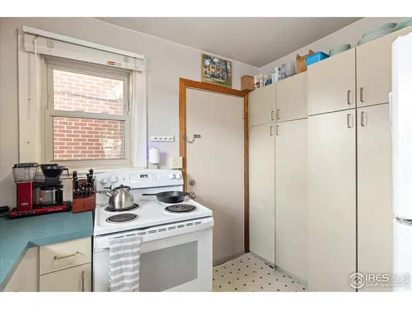 a view of a livingroom with furniture and a flat screen tv