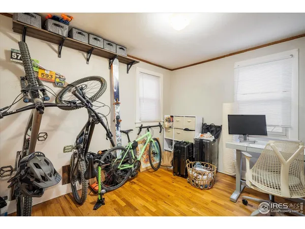 a view of a house with wooden fence