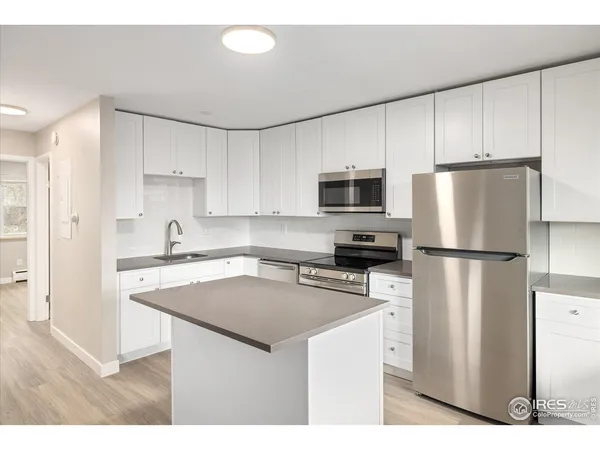 a view of kitchen with wooden floor