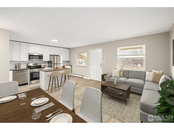 a view of an empty room and wooden floor