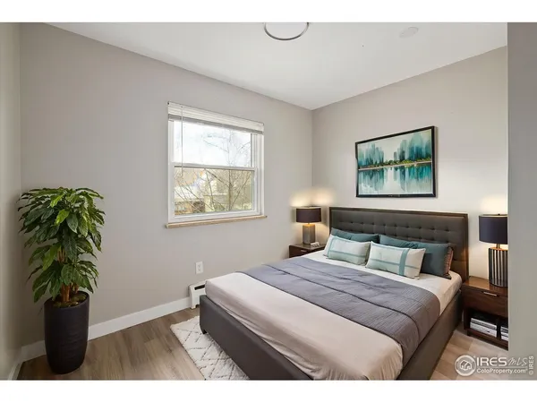 a kitchen with granite countertop a sink a stove and cabinets