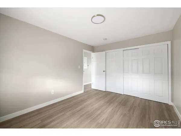 a bedroom with a bed and a potted plant