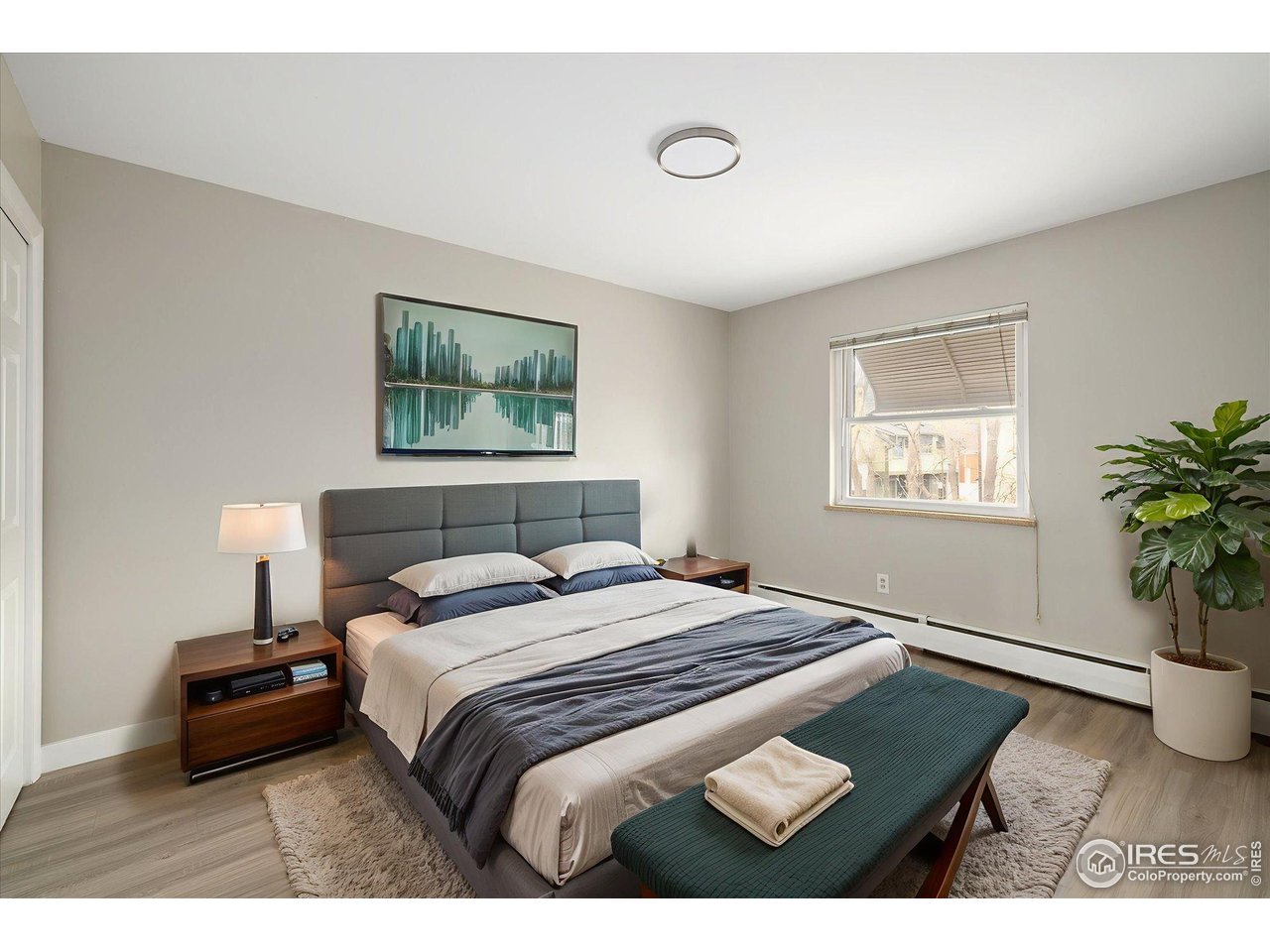 1938 Spruce Street Boulder, CO 80302 - Photo 31 of 50 a bedroom with a bed and a potted plant