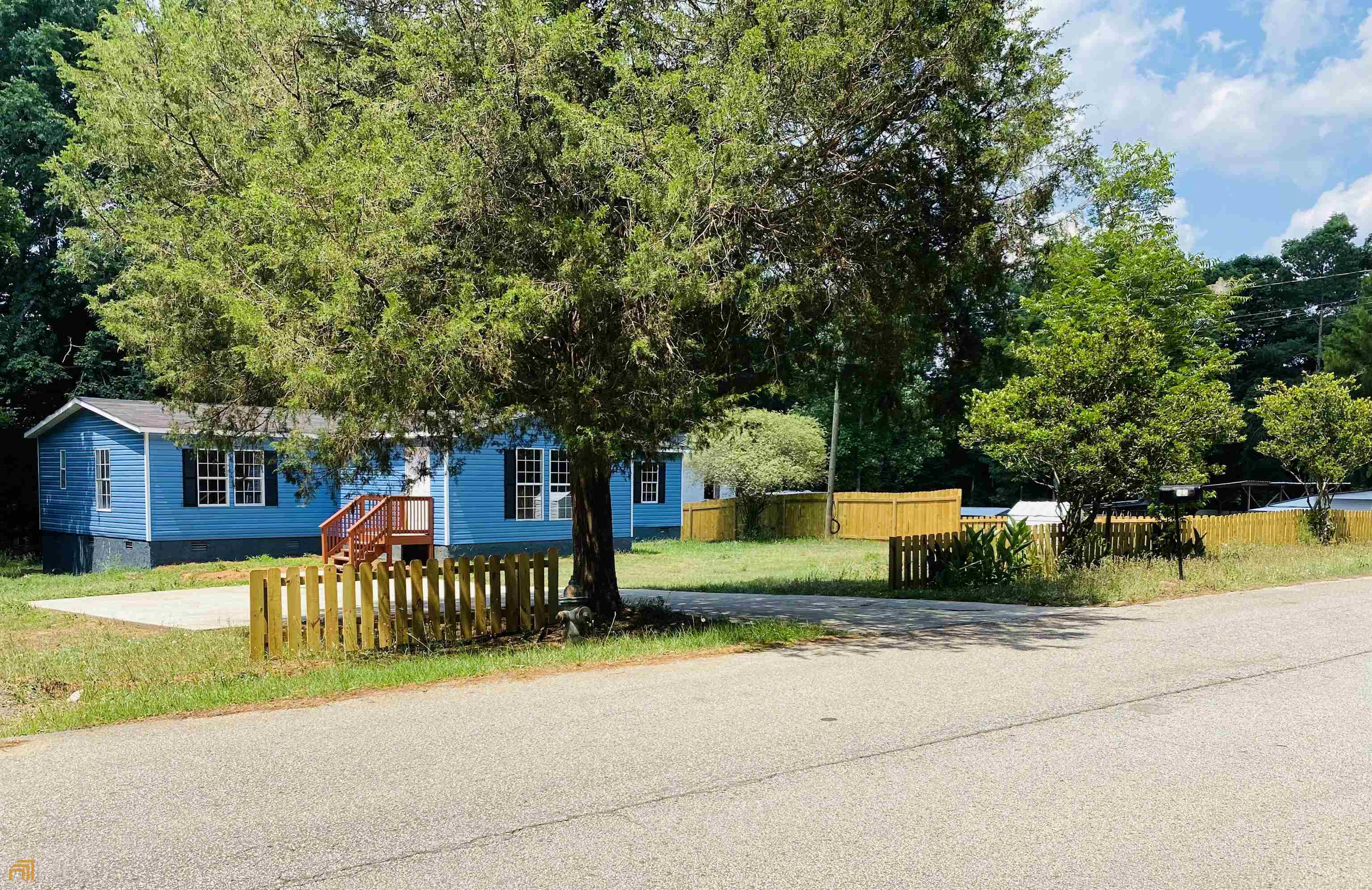55 Taunton Road Covington, GA 30014 - Photo 1 of 1 a view of a house with a patio