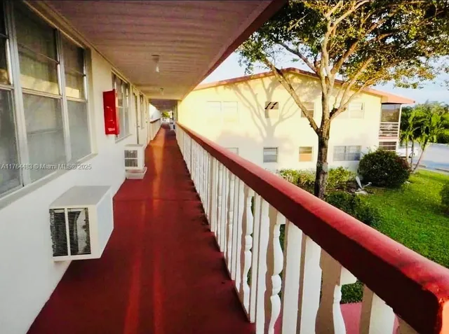 a view of a garden and swimming pool