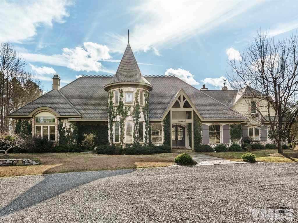Stone, leaded class windows in the turret, and covered front entry contribute to the character and charm.