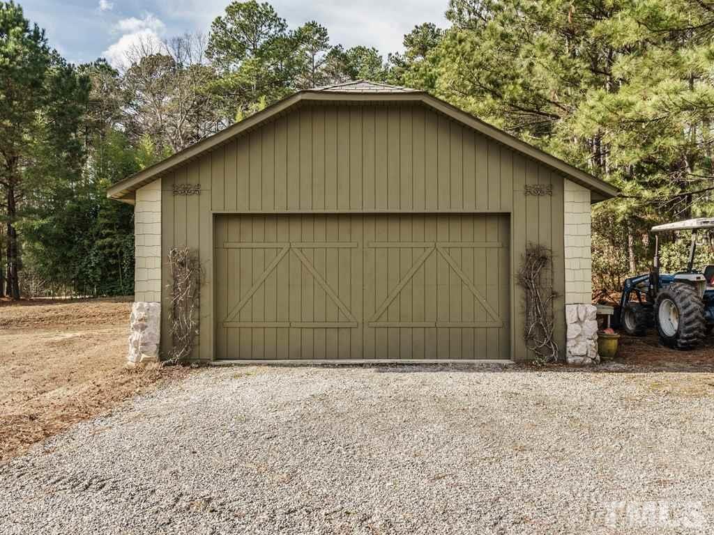 2125 Olive Chapel Road Apex, NC 27502 - Photo 24 of 25 Second two car garage has workshop space as well.