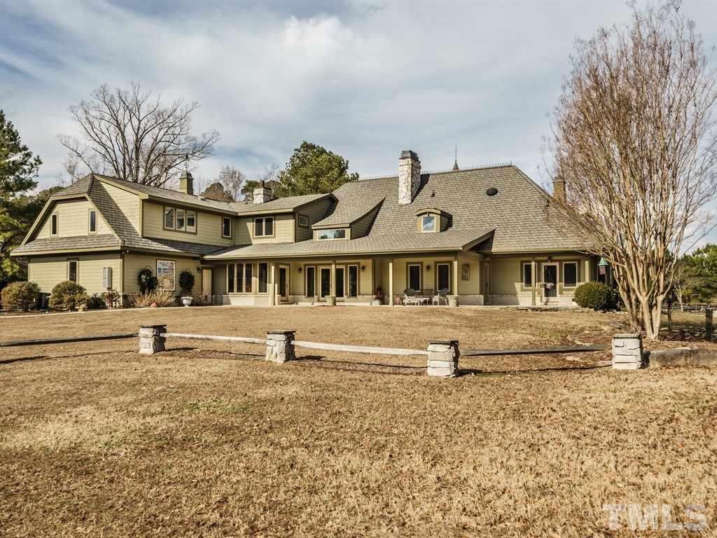 2125 Olive Chapel Road Apex, NC 27502 - Photo 25 of 25 View of the rear of the home from the large meadow behind.