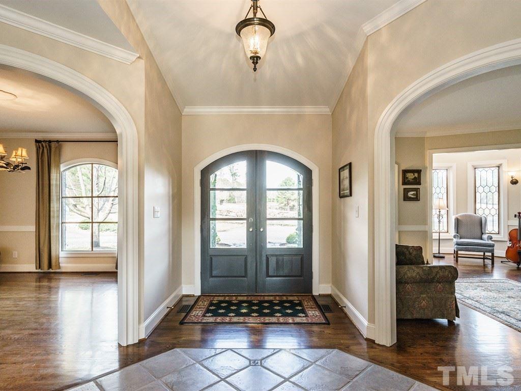 Entry hall with formal Living and Dining rooms on either side.