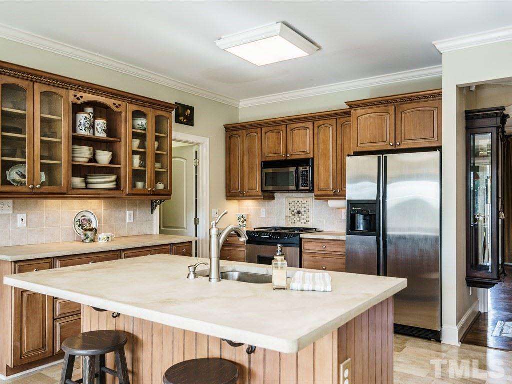 2125 Olive Chapel Road Apex, NC 27502 - Photo 8 of 25 Another view of kitchen. Walk in pantry is located through the door on the left.