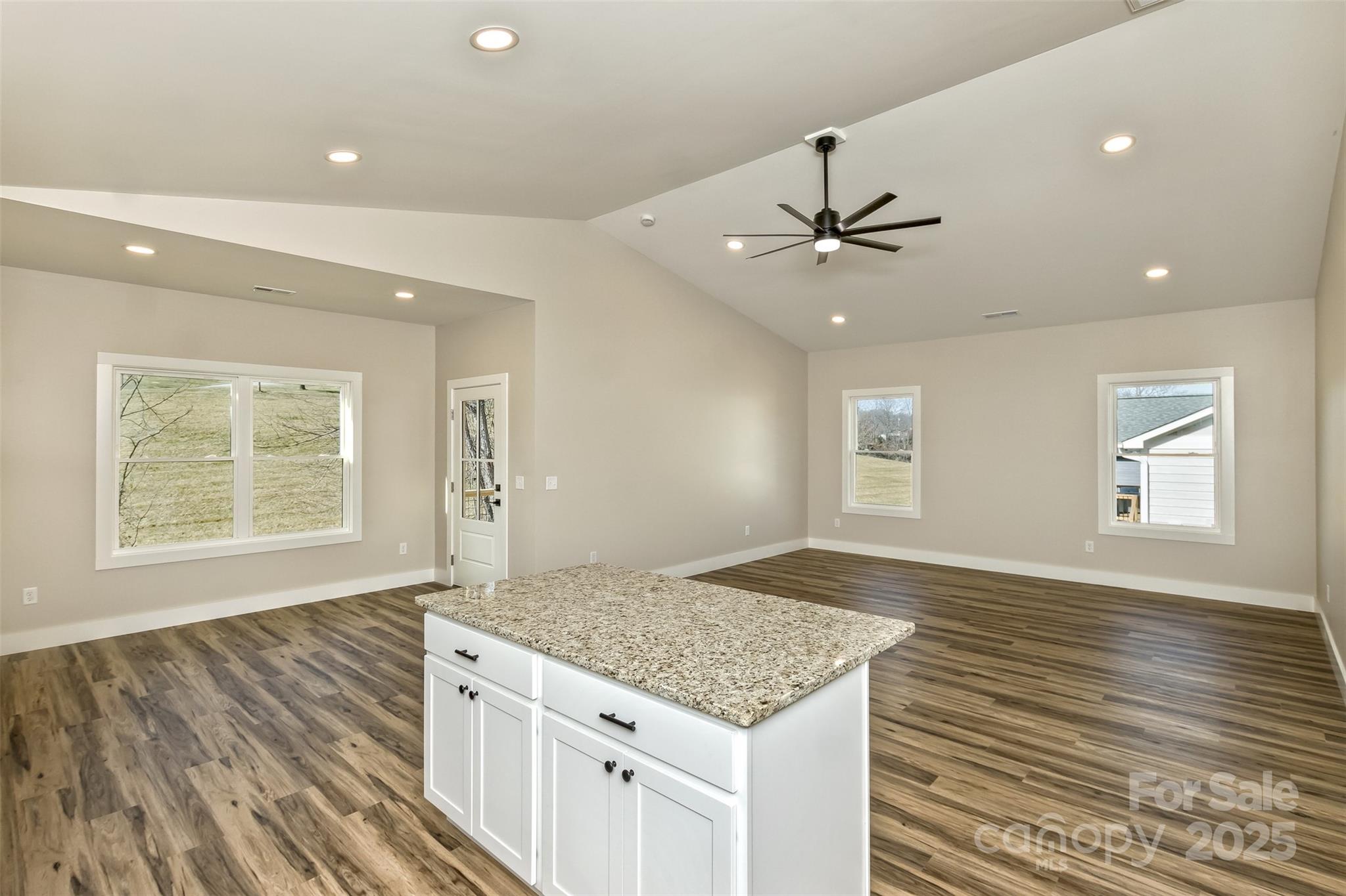 115 Peyton Elaine Road Clyde, NC 28721 - Photo 11 of 37 an empty room with windows & ceiling fan