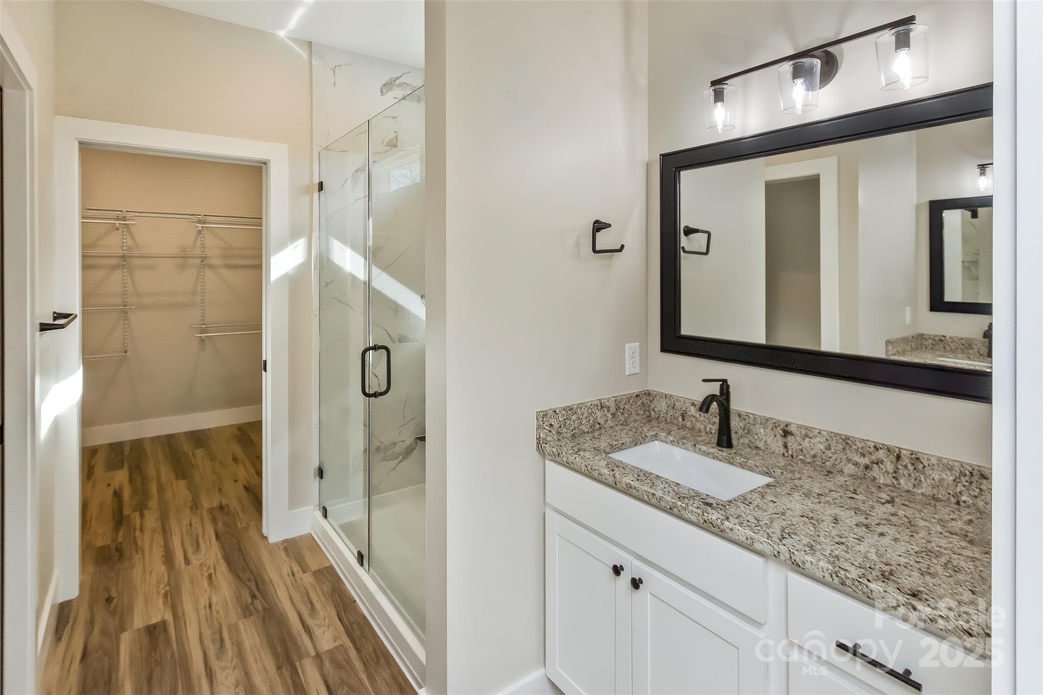 115 Peyton Elaine Road Clyde, NC 28721 - Photo 18 of 37 a bathroom with a granite countertop sink and a mirror