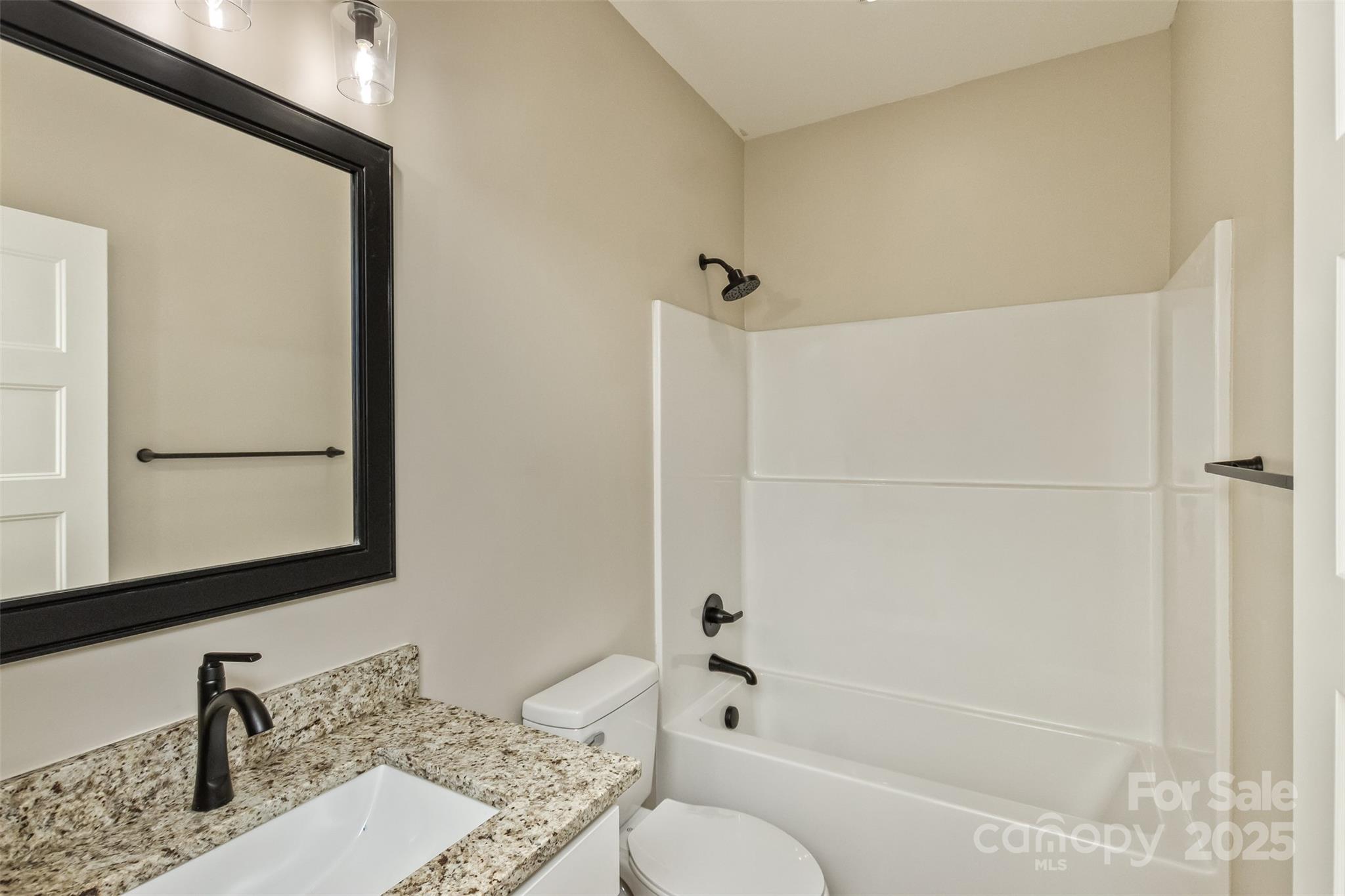 115 Peyton Elaine Road Clyde, NC 28721 - Photo 22 of 37 a bathroom with a granite countertop sink toilet and shower