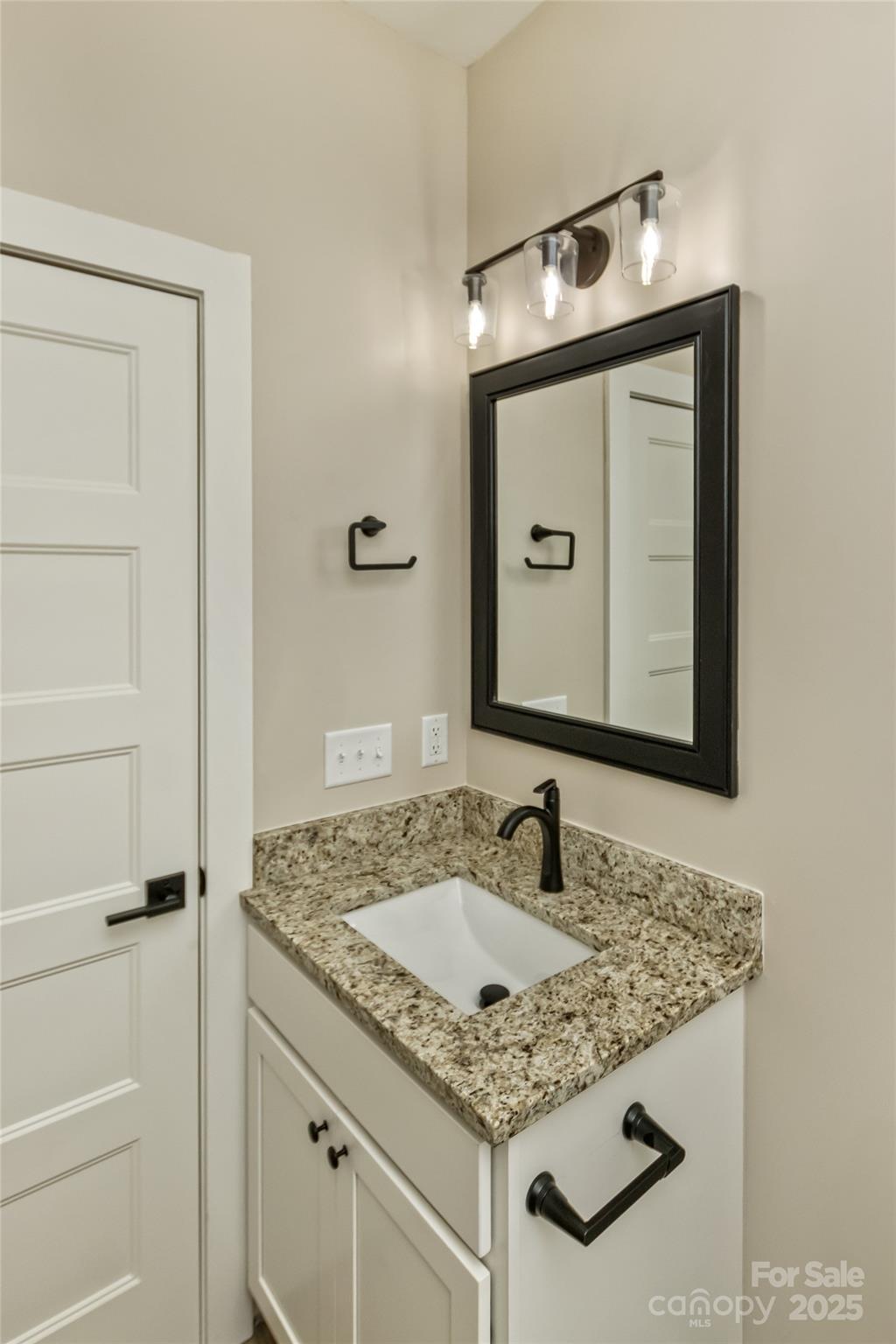 115 Peyton Elaine Road Clyde, NC 28721 - Photo 23 of 37 a bathroom with a granite countertop sink and a mirror