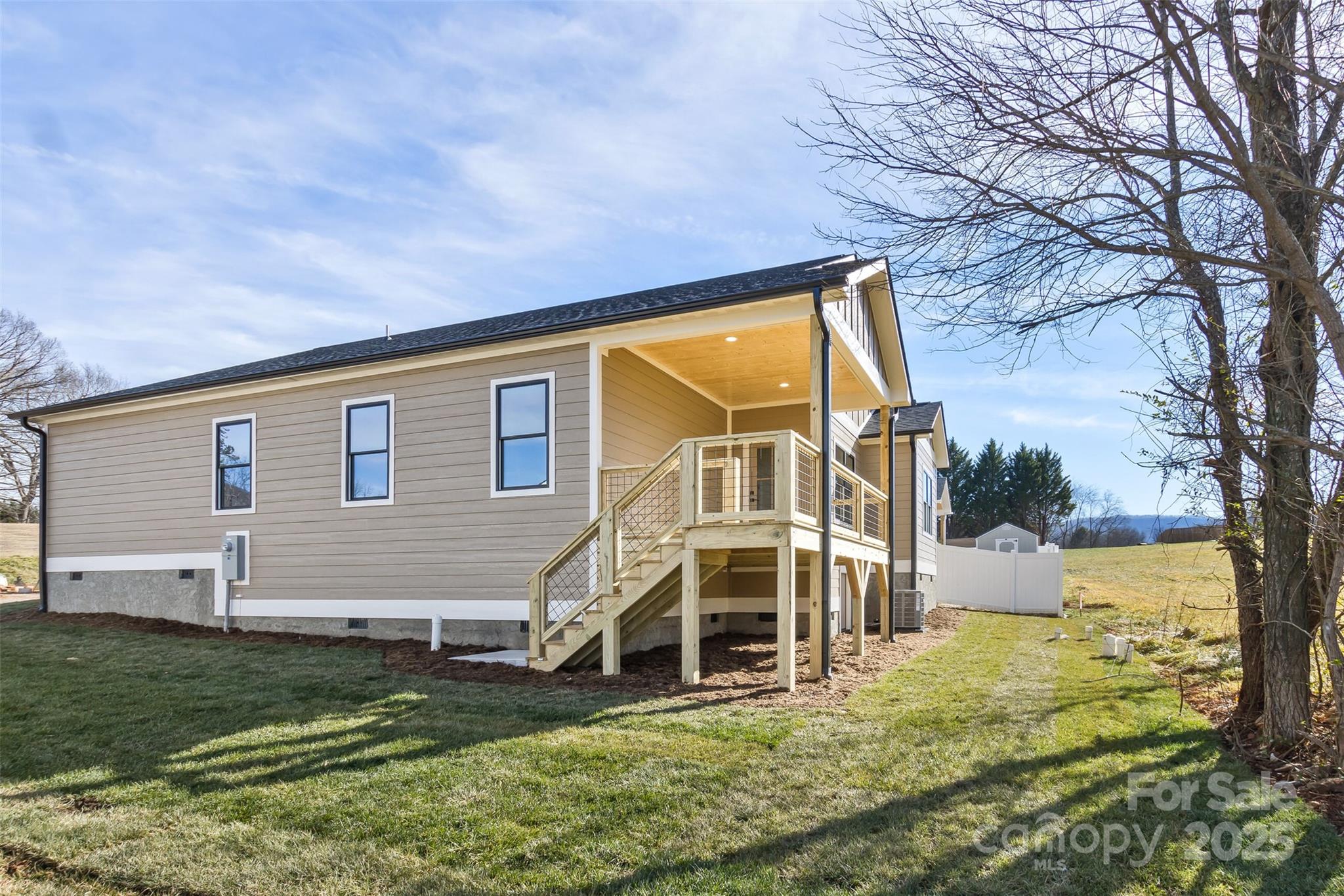 115 Peyton Elaine Road Clyde, NC 28721 - Photo 4 of 37 a view of a house with a yard