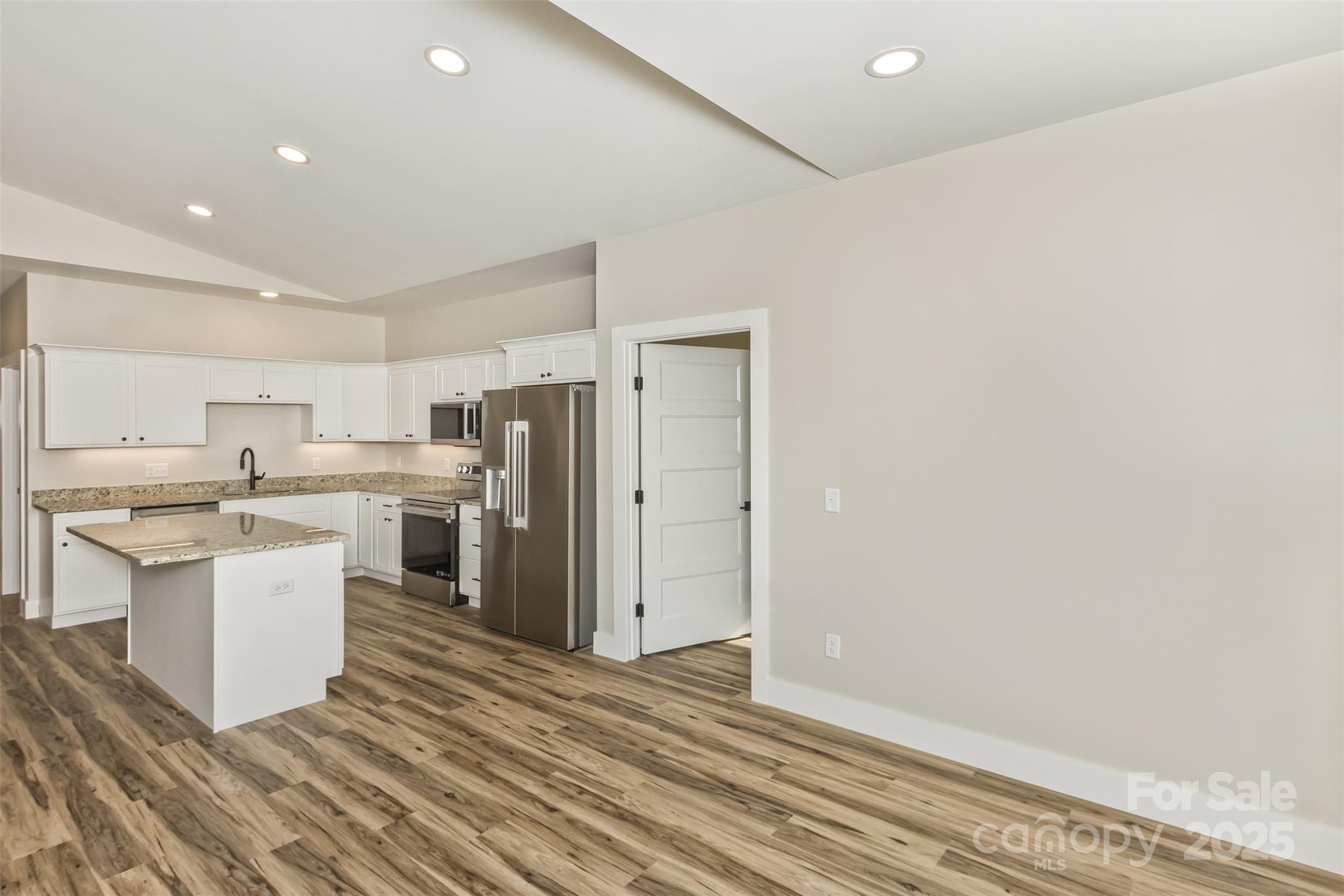 115 Peyton Elaine Road Clyde, NC 28721 - Photo 7 of 37 a view of kitchen with wooden floor