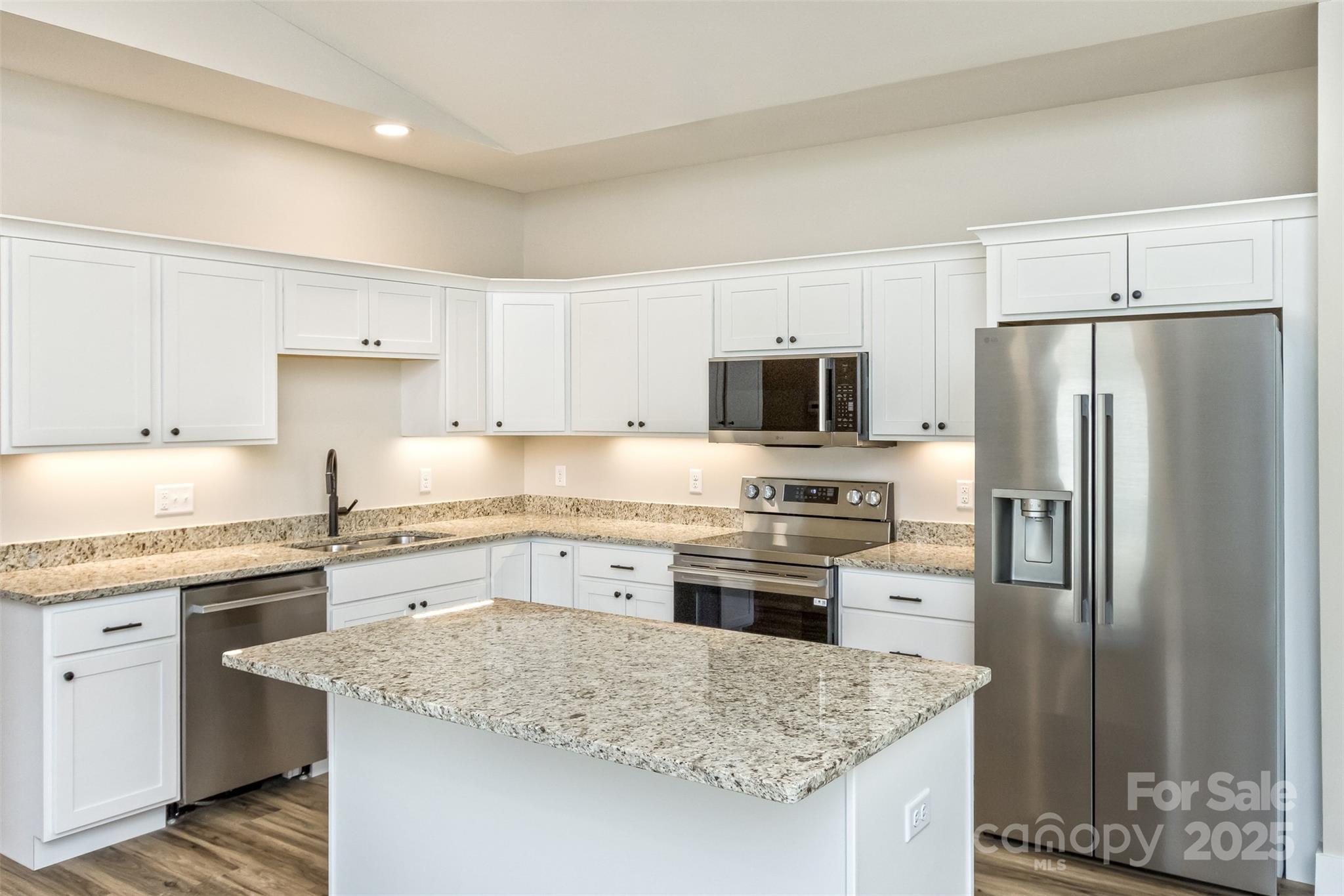 115 Peyton Elaine Road Clyde, NC 28721 - Photo 8 of 37 a kitchen with kitchen island granite countertop cabinets stainless steel appliances and a counter space