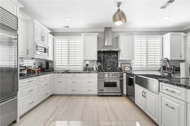 a bathroom with a double vanity sink a mirror and a shower