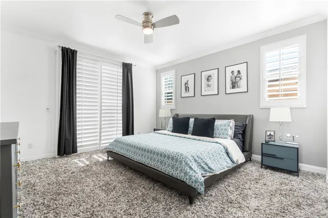 a living room with furniture wooden floor and a large window
