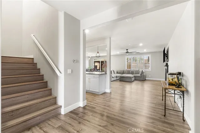 a dining room with furniture and wooden floor