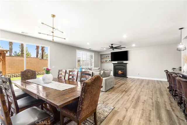 a spacious bedroom with a bed and a dresser