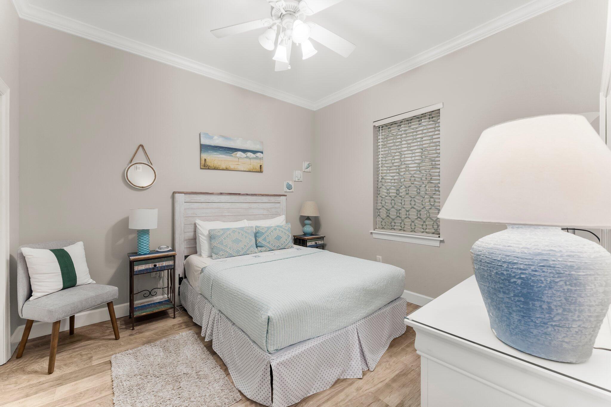 231 Somerset Bridge Road, Unit 2209 Santa Rosa Beach, FL 32459 - Photo 14 of 30 a bedroom with a bed and a chair