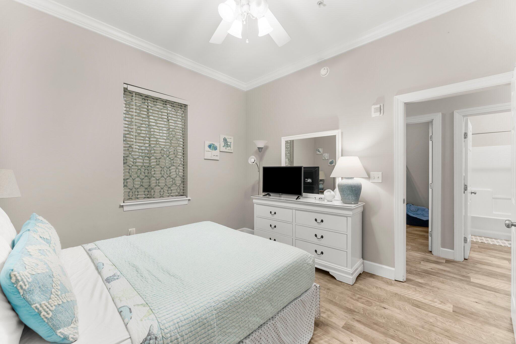 231 Somerset Bridge Road, Unit 2209 Santa Rosa Beach, FL 32459 - Photo 15 of 30 a bedroom with a bed and a flat screen tv
