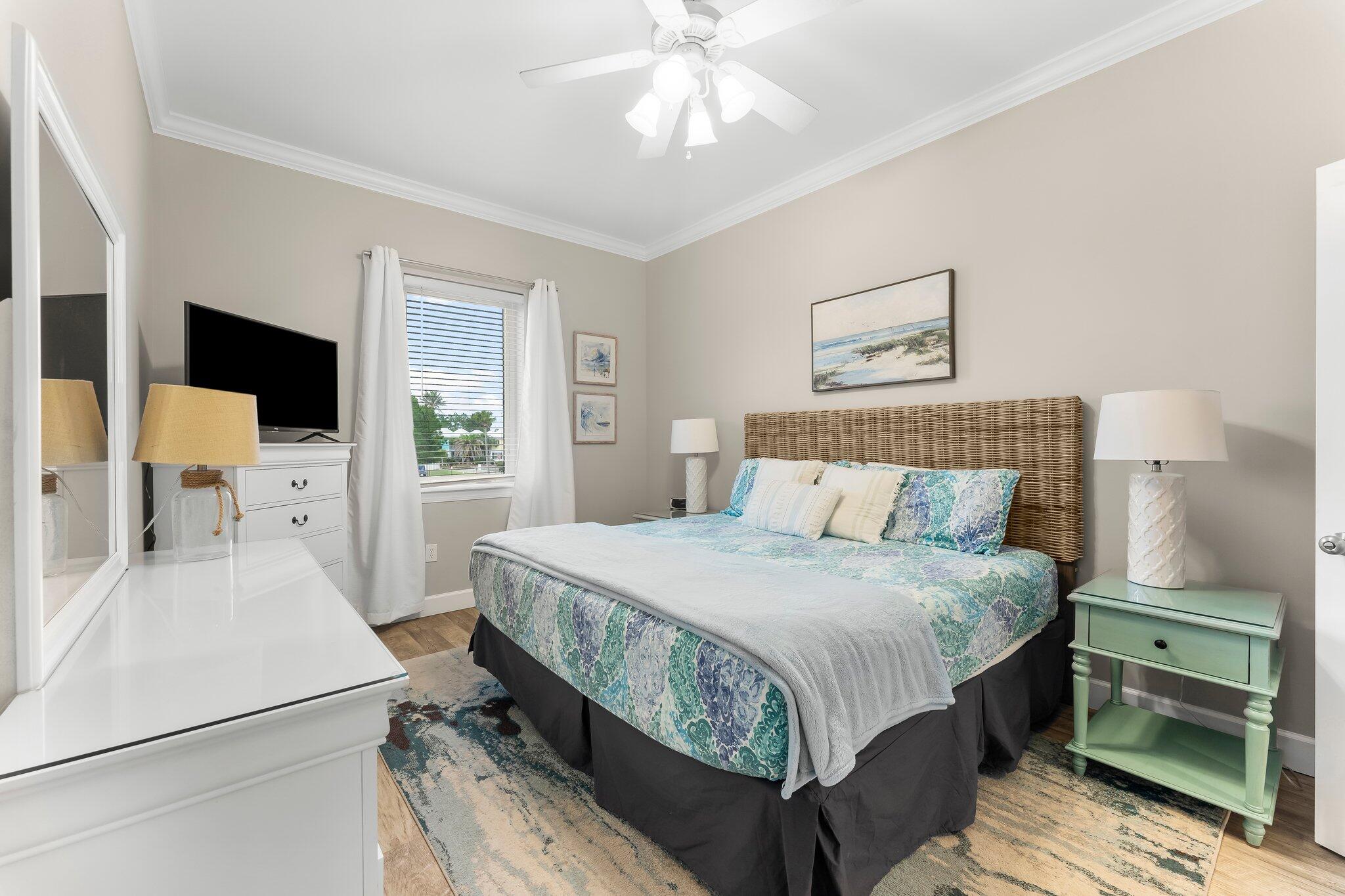231 Somerset Bridge Road, Unit 2209 Santa Rosa Beach, FL 32459 - Photo 17 of 30 a bedroom with a bed and a flat tv screen on dresser