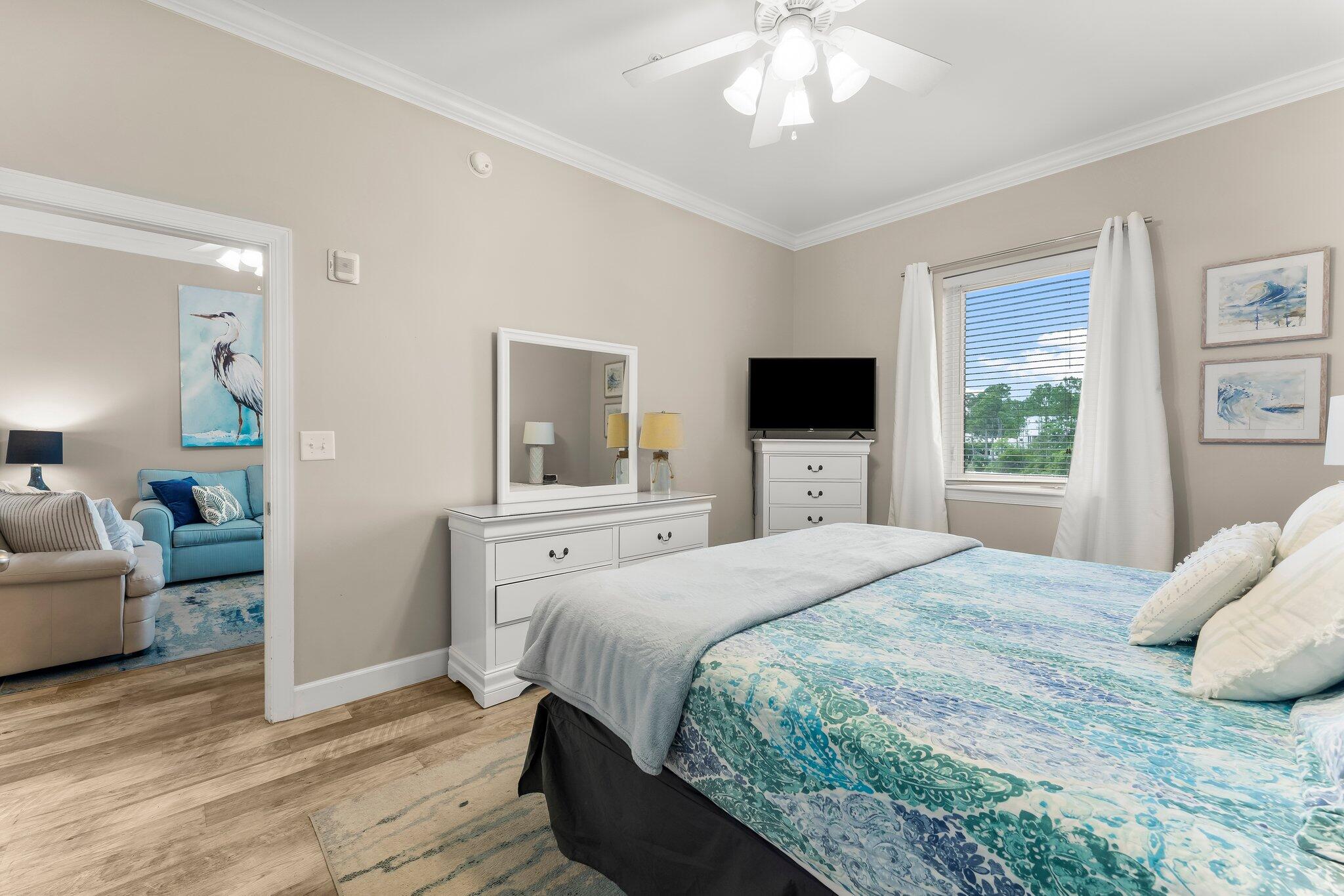 231 Somerset Bridge Road, Unit 2209 Santa Rosa Beach, FL 32459 - Photo 18 of 30 a bedroom with a large bed and a flat screen tv