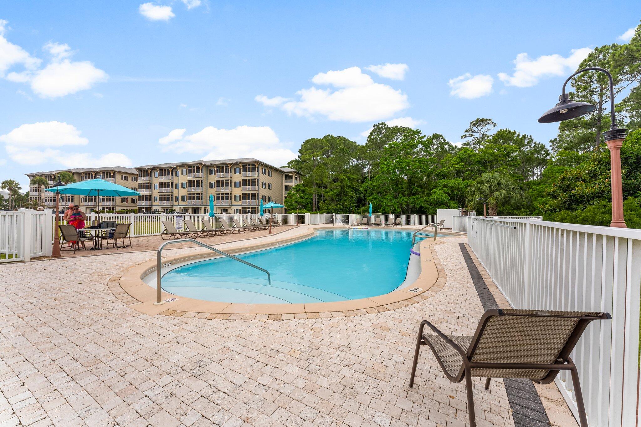 231 Somerset Bridge Road, Unit 2209 Santa Rosa Beach, FL 32459 - Photo 29 of 30 a view of a swimming pool with a lounge chair