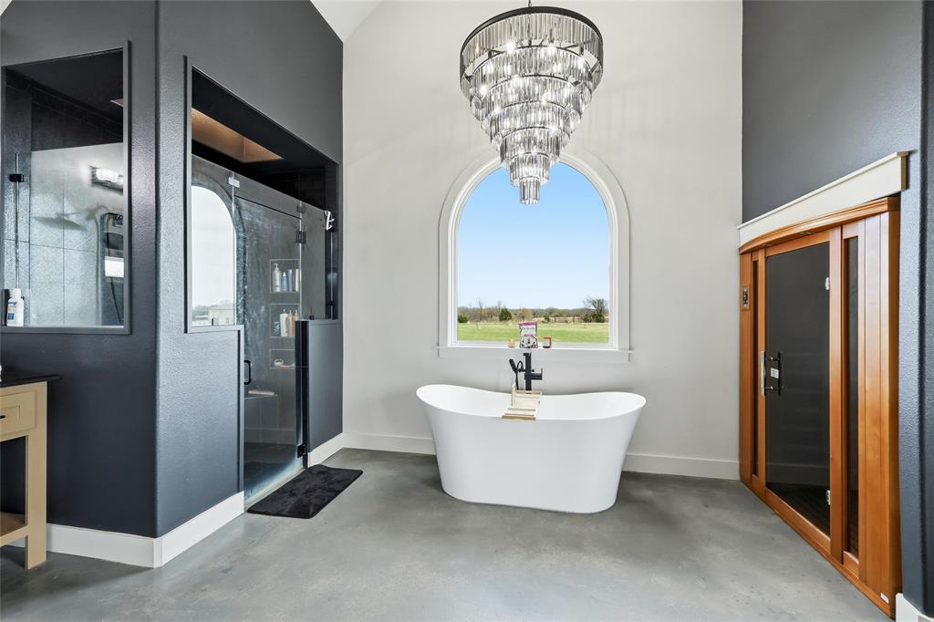 3988 Lake Valley Road Sunset, TX 76270 - Photo 18 of 39 a spacious bathroom with a bathtub and shower