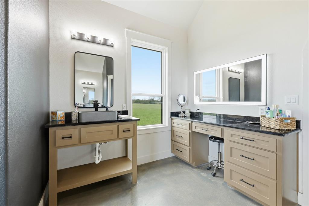 3988 Lake Valley Road Sunset, TX 76270 - Photo 19 of 39 a bathroom with a granite countertop sink mirror and a