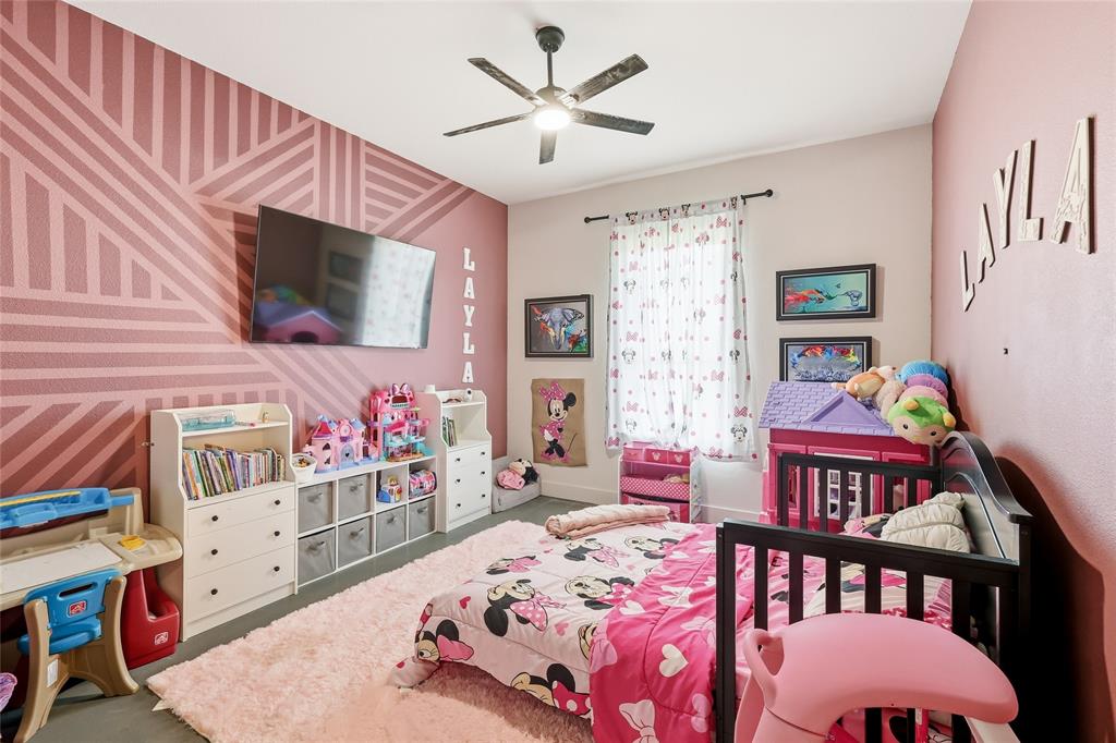 3988 Lake Valley Road Sunset, TX 76270 - Photo 23 of 39 a bedroom with furniture and a flat screen tv