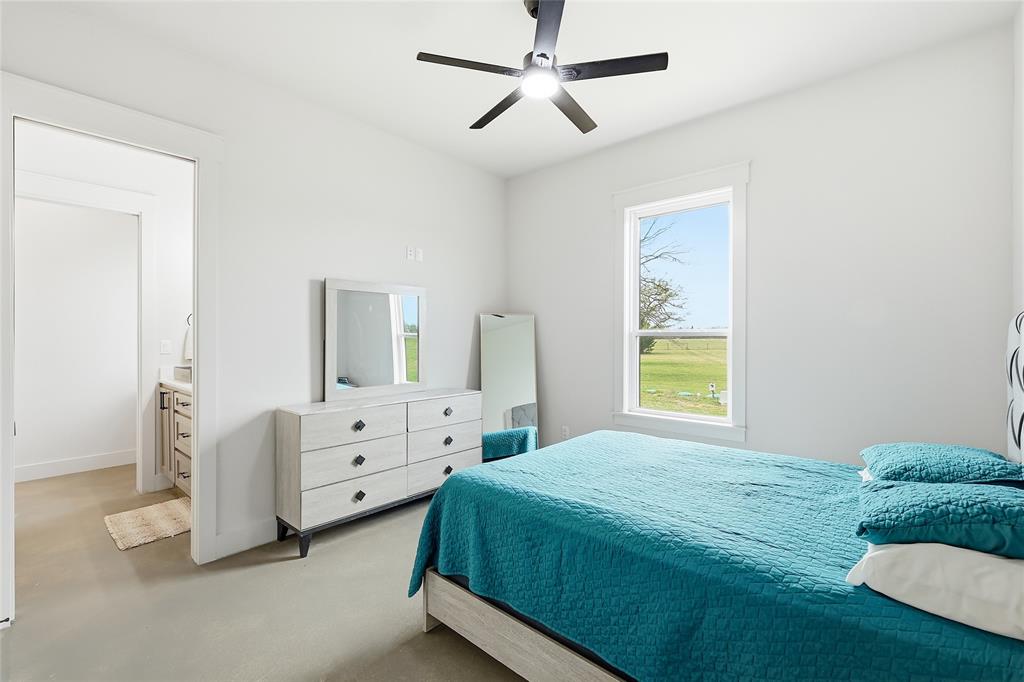 3988 Lake Valley Road Sunset, TX 76270 - Photo 25 of 39 a bedroom with a bed and a window