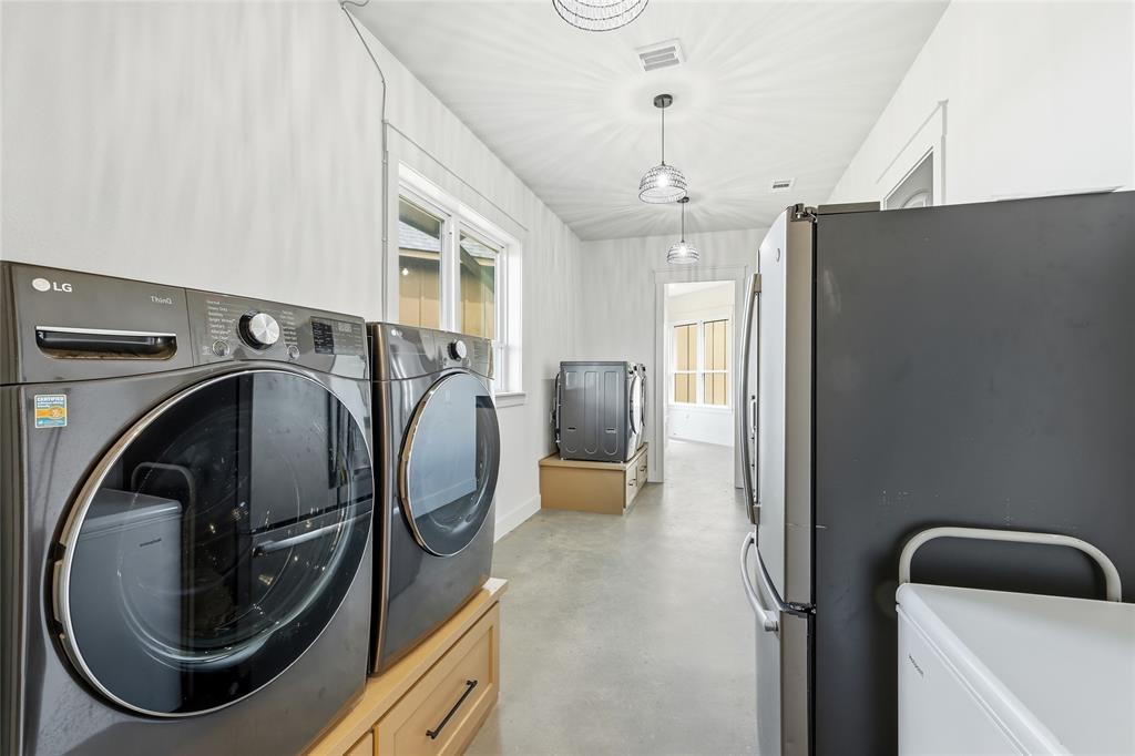3988 Lake Valley Road Sunset, TX 76270 - Photo 27 of 39 a utility room with dryer and washer