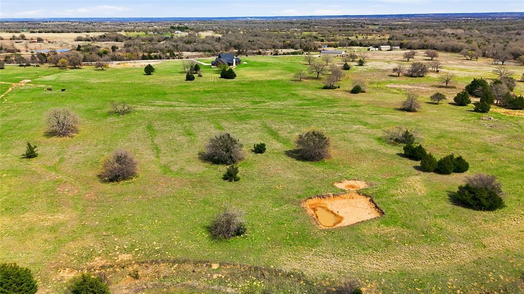 3988 Lake Valley Road Sunset, TX 76270 - Photo 39 of 39 a view of a houses with a yard