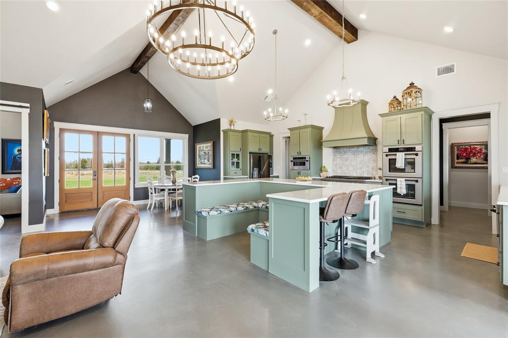 3988 Lake Valley Road Sunset, TX 76270 - Photo 5 of 39 a large kitchen with a table and chairs