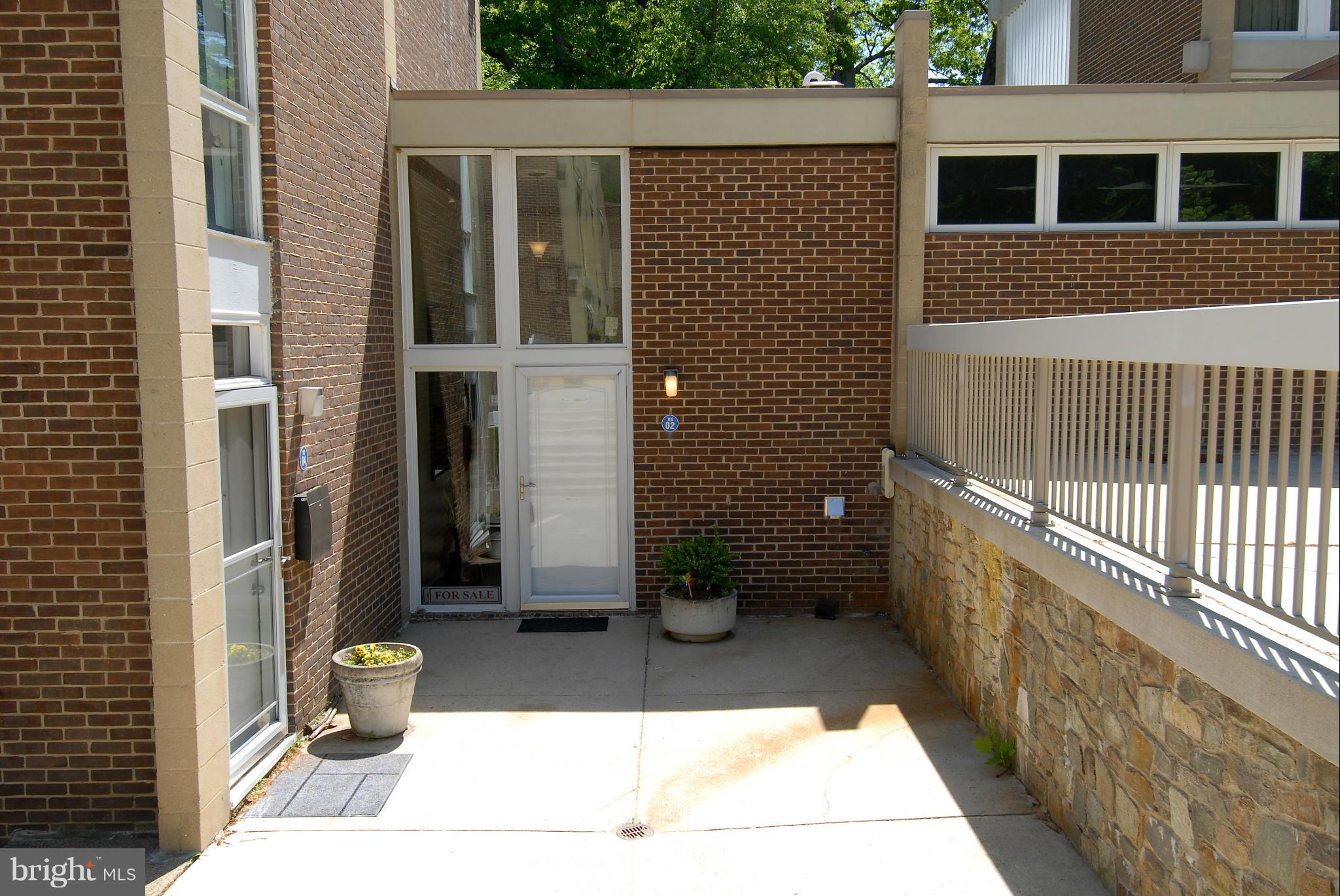 11502 Hickory Cluster Reston, VA 20190 - Photo 1 of 29 a view of a house with backyard and sitting area