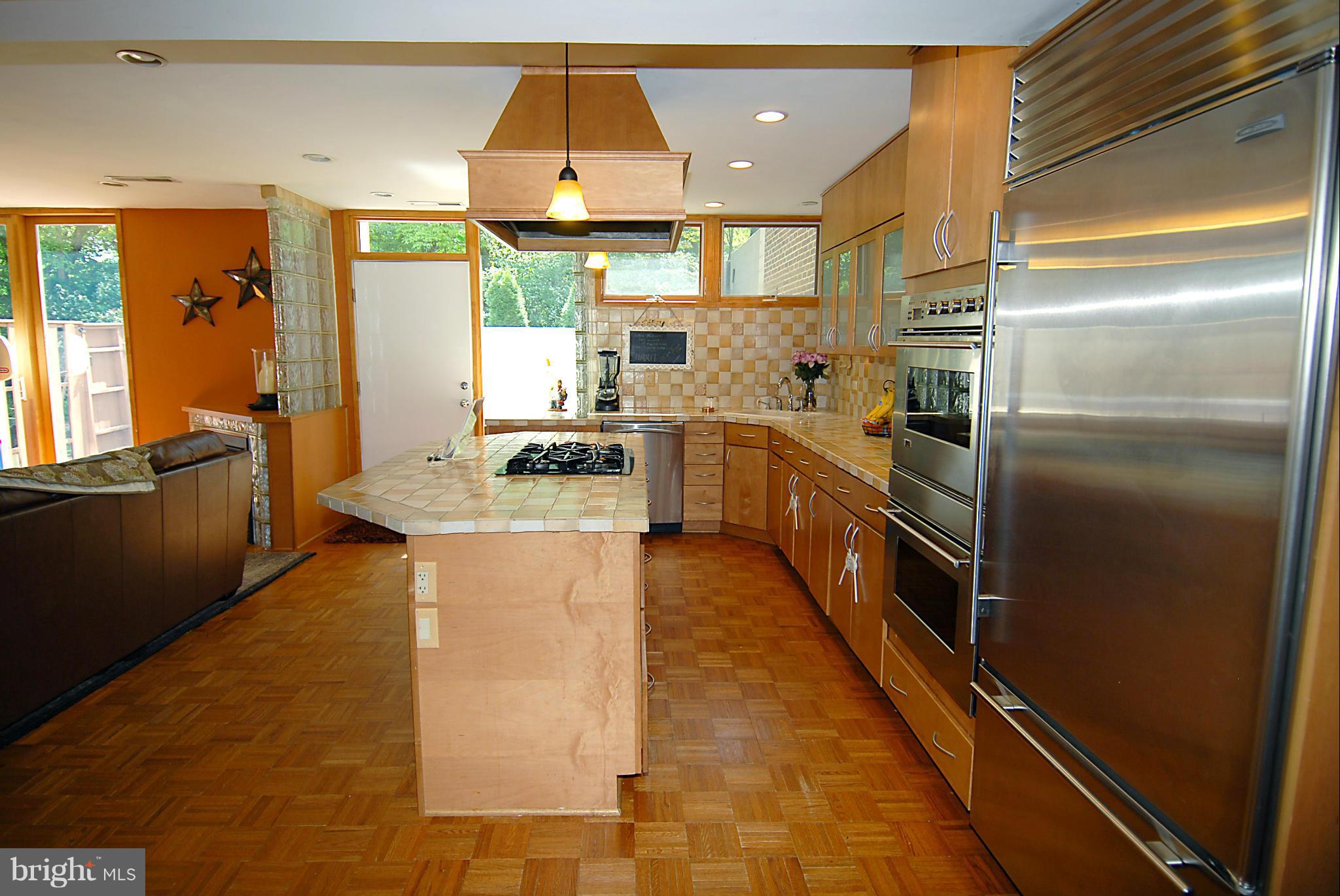 11502 Hickory Cluster Reston, VA 20190 - Photo 7 of 29 a kitchen with stainless steel appliances granite countertop a refrigerator a stove and a sink