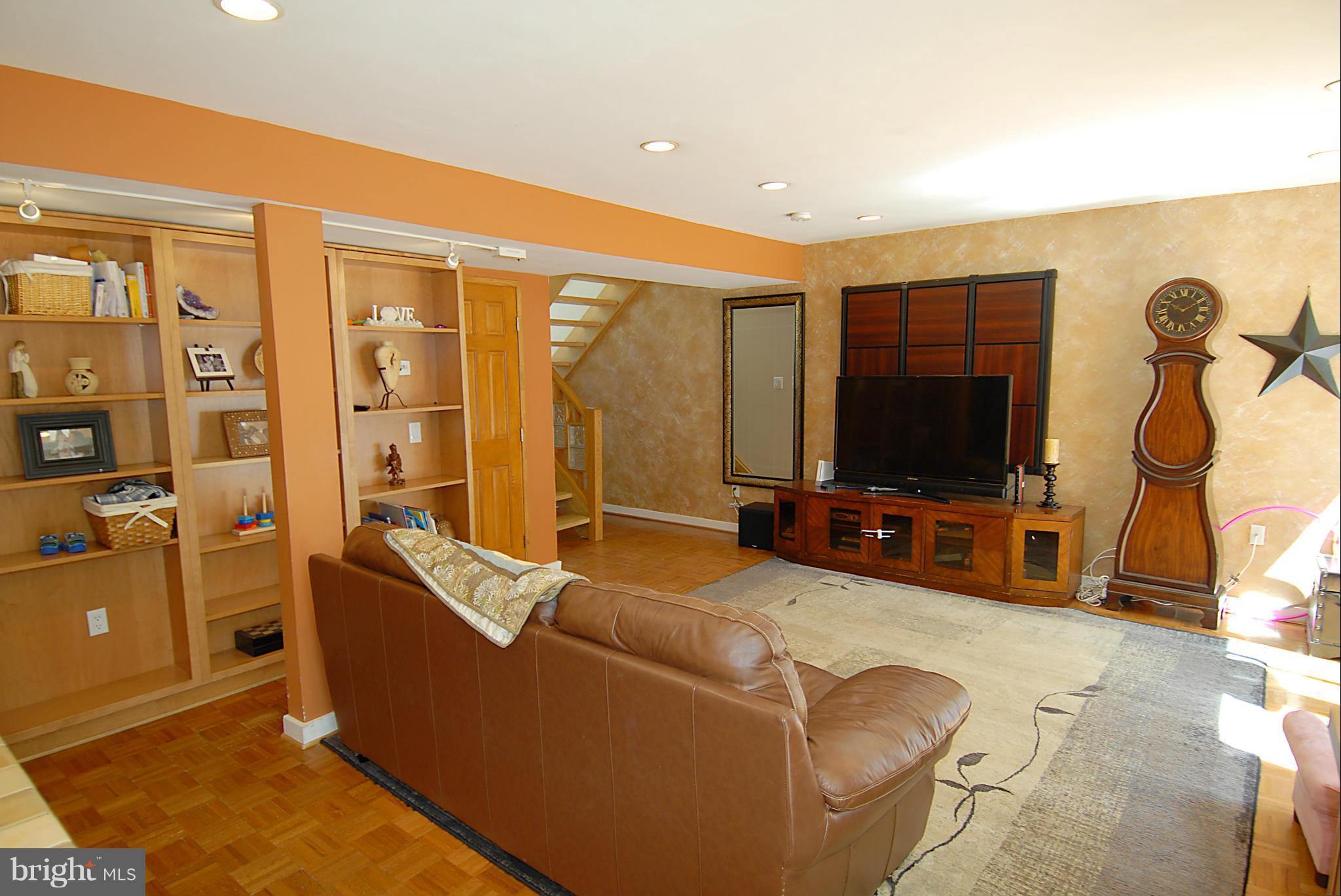 11502 Hickory Cluster Reston, VA 20190 - Photo 9 of 29 a living room with furniture and a flat screen tv