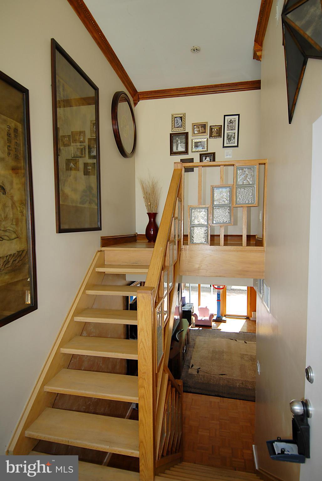 11502 Hickory Cluster Reston, VA 20190 - Photo 10 of 29 a view of staircase with white walls and a window