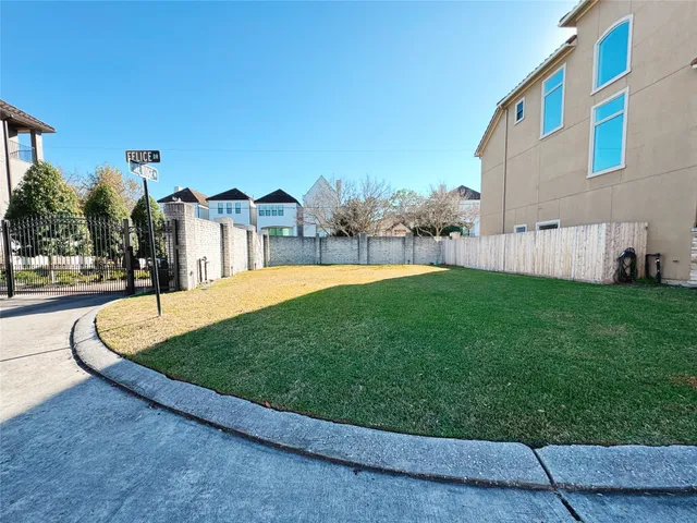 a view of a garden with a house