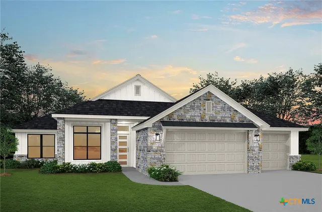 a front view of a house with a garden and plants