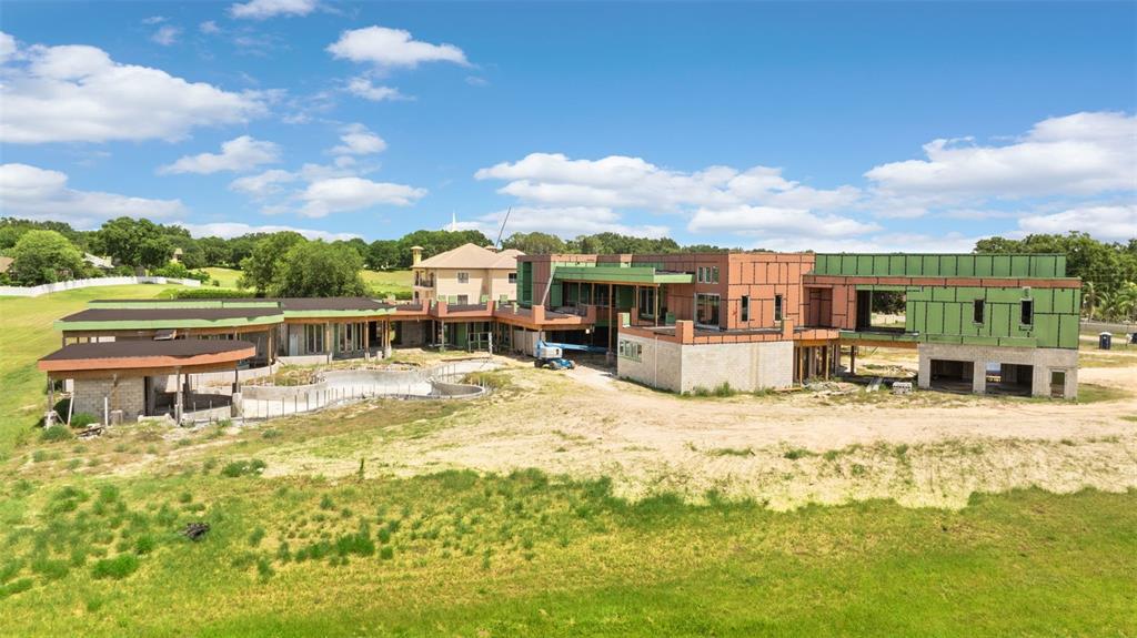 9621 Windy Ridge Road Windermere, FL 34786 - Photo 14 of 28 a view of a swimming pool with an ocean view