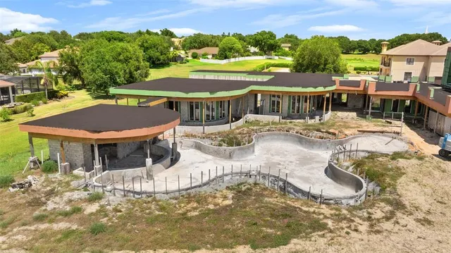 a view of a patio with swimming pool and mountain view