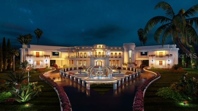 9621 Windy Ridge Road Windermere, FL 34786 - Photo 5 of 28 a view of a patio with table and chairs potted plants and large tree