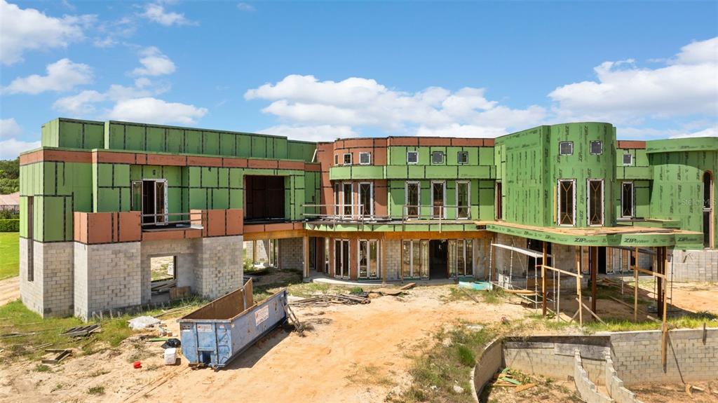 9621 Windy Ridge Road Windermere, FL 34786 - Photo 9 of 28 a view of a house with a patio
