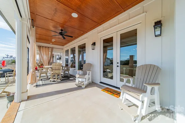 a view of a patio with a dining table and chairs