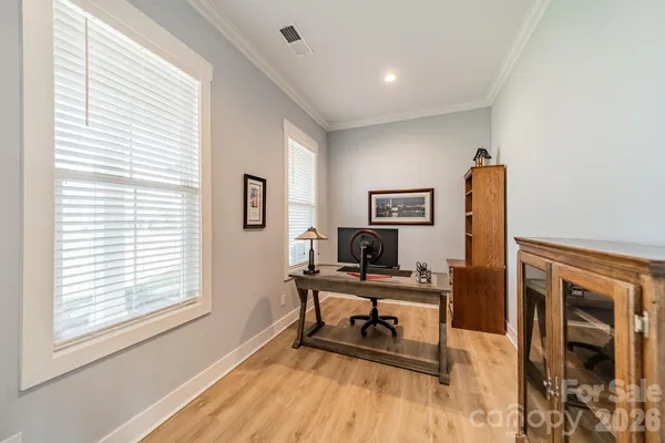 a workspace with furniture and a window